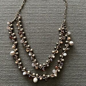 Muted gold color, metal necklace 18 inches adjustable with beads from Loft